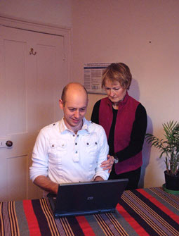 A photo of Anna Cooper working with a patient 